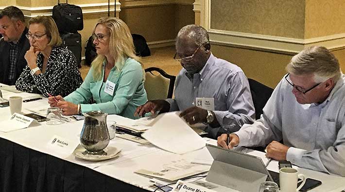 Pictured, from left to right, during one of the Board meetings are Brandon Chapman, Yanna Patton, Heather Gastelum, Ron Lewis and Duane MacEntee.