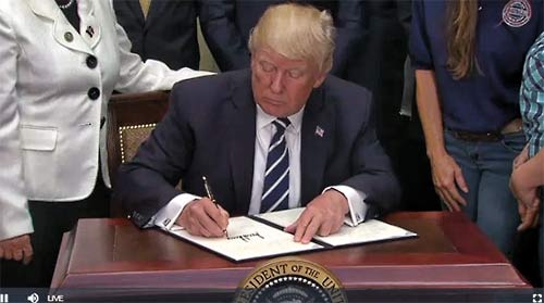 President Donald Trump signed an executive order on Thursday that looks to expand apprenticeships and job-training programs by giving more freedom to third-party companies and schools.