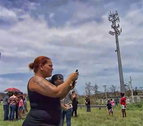 Pretzel-like antenna arrays and no backup power has residents struggling to get cell service in most areas of Puerto Rico.