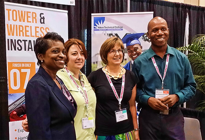 FCC Chairman Mignon Clyburn was well-known for her support of net neutrality as well as her concern for tower climber safety. Pictured (from left) at an exhibit booth of Aiken Technical College are Clyburn, Molly Cooper, Dr. Gemma Frock and Nathaniel Hatchett