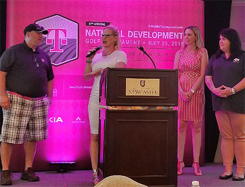 Leaders of  T-Mobile's National Development team, from left, Allan Tantillo, Heather Gastelum, Katie Miller and Stacie Harwood, take the stage to speak during the golf event's reception
