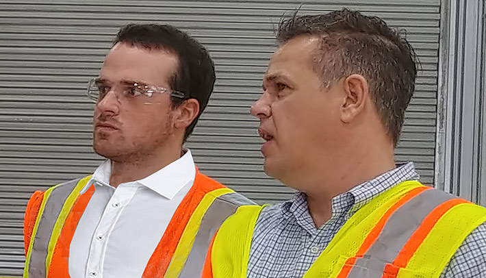 Evan Swarztrauber, left, is given a tour of CommScope's Euless, Tex. manufacturing facility by Vice President Darin Piburn