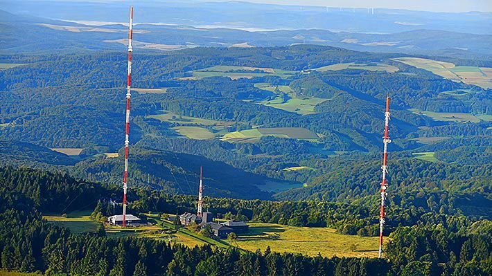 Three tower techs in Germany were killed when their man basket fell from the 164-foot level where they were installing a new antenna on the guyed tower at left