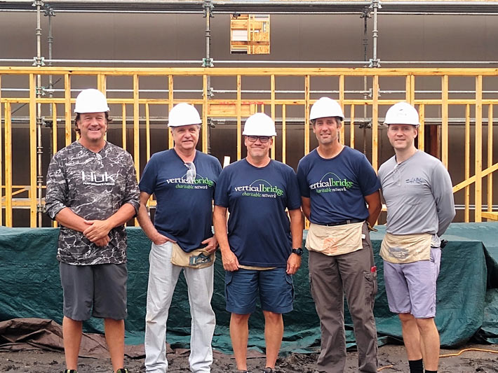 Vertical Bridge team members (from left) Bill Maxwell, Gustavo Figueiredo, Richard Biederwolf, Mike Szafoni and Steve Hedges at a Habitat for Humanity Build in Chicago. 