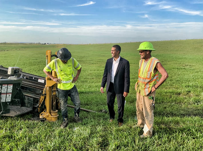 FCC Chairman Ajit Pai visits with workers laying fiber optic cable in North Dakota.