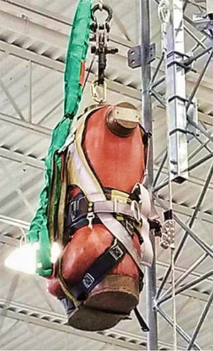 A 310-pound torso in a harness test weight was used in addition to an eight-foot sling safety strap to protect the test weight from hitting the laboratory floor