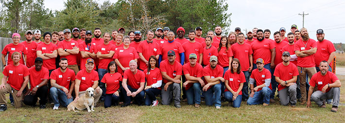 MillerCo employees pose for a company portrait with Rooney, MillerCo's 14-year-old tower dog mascot.MillerCo Inc., a privately held woman-owned Mississippi Corporation, specializes in the installation, repair, and upgrades on all medium and high-intensity lighting systems and their respective monitoring products. Founded by Jimmy Miller, President, in 1997, MillerCo began with one man in one truck doing one job.