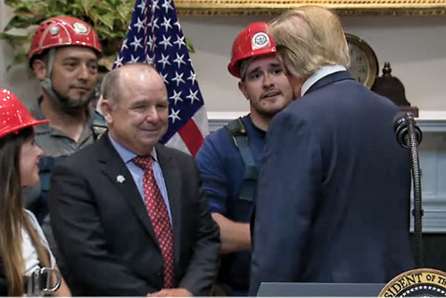 President Trump shakes hands with a tower technician, thanking him for his service to ensure that 5G can be built out with the dedication of talent of telecom workers.