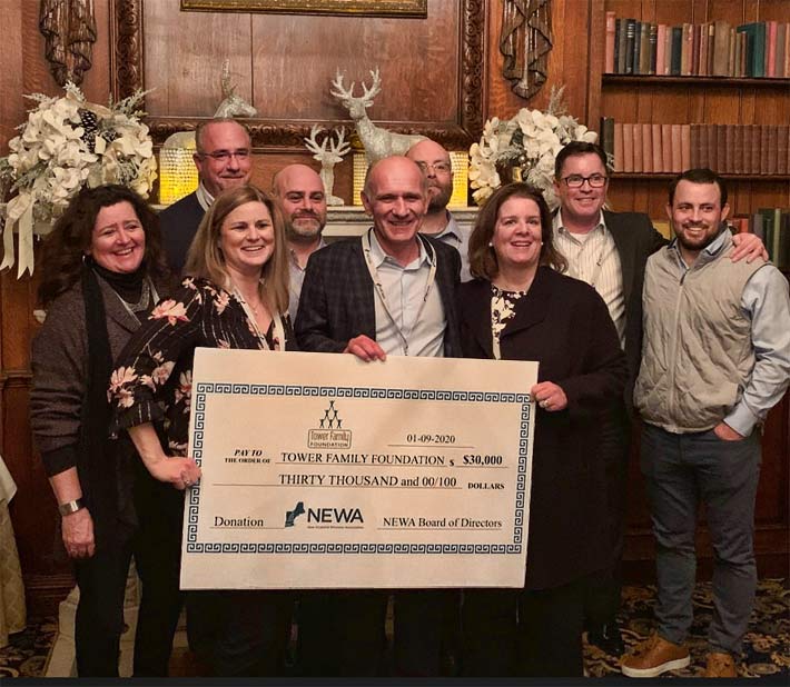 Pictured during the presentation to the Tower Family Foundation are (Front Row, L to R) Kelly Dunn, SAI; Heather Harrington, Sprint: Victor Drouin, Tower Family Foundation. Back Row, L to R: Hans Fiedler, T-Mobile; Brian Grossman, Bowditch and Dewey; Ben Revette, Dewberry Engineers; Steve Kelly, Timberline Construction; and Andrew Thompson, Centerline Communications.
