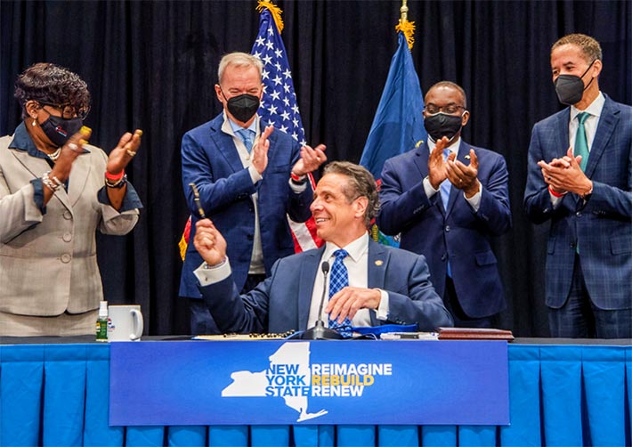 NY Governor Andrew Cuomo signed the $15 per month ISP legislation. He said he expected Friday's lawsuit.