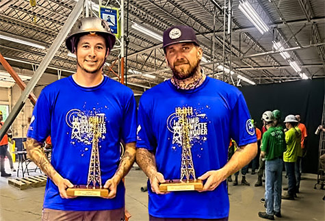 TOUGH TOWER CLIMBERS John Martinez, at left, and Michael Flynn won the competition’s top prize on Sunday, as well as sharing $7,500 for displaying their skill and industry knowledge. Both climbers have 12 years of experience in the industry.