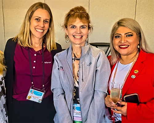 Chairwoman of Women of NATE Lindsey Westphal, center, with two of her colleagues at the conference's networking event.